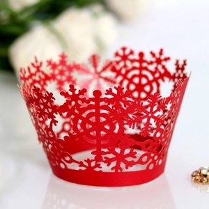 Red laser-cut snowflake cupcake wrappers for Christmas and winter themed parties