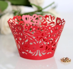 Elegant red laser-cut cupcake wrappers with intricate butterfly and floral patterns