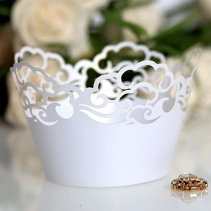 White laser-cut cupcake wrappers with elegant cloud wave pattern for party decoration