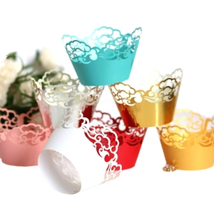 Hollow laser cut cupcake wrappers with auspicious cloud patterns in multiple colors