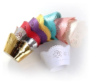 Laser-cut rose pattern cupcake wrappers in multiple metallic colors for wedding cakes