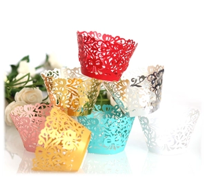 Detailed laser-cut vine patterns on multi-colored decorative cupcake wrappers
