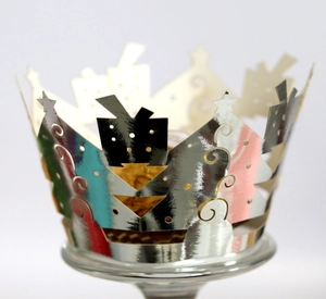 Silver crown cupcake wrapper with laser-cut star and gift box patterns for parties