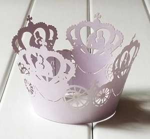 Intricate laser-cut lavender cupcake wrapper with crown and pumpkin carriage design