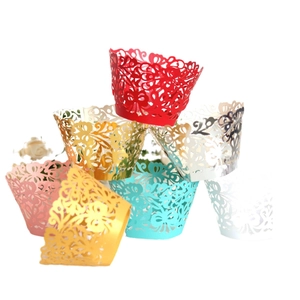 Intricate laser-cut hollow lace cupcake wrappers in multiple vibrant colors for party decor