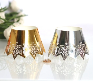 Laser-cut maple leaf cupcake wrappers in gold and silver finish with mirror effect