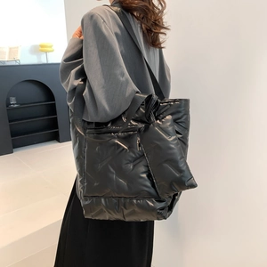 Black quilted down puffer tote bag with small matching pouch for winter fashion