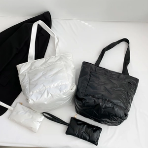 Quilted puffer tote bag set with matching pouch in black and white glossy finish