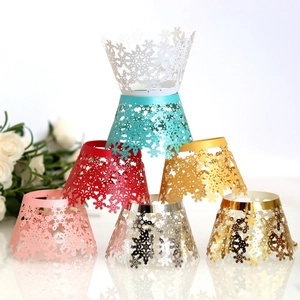 Laser cut snowflake cupcake wrappers in various metallic colors for Christmas decoration
