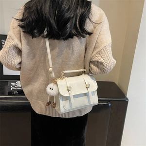White minimalist crossbody square bag with cute fur pendant and adjustable strap