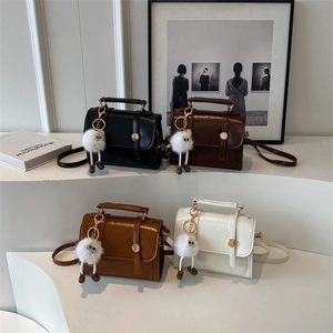 Minimalist vintage crossbody handbags in four colors with furry monster charms