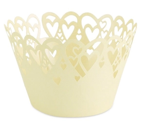 Laser-cut cream paper cupcake wrappers with hollow heart patterns for wedding party decor