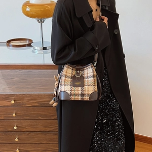 Retro plaid bucket bag with brown leather trim and cute rabbit doll keychain