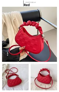 Detailed views of a red litchi leather handbag with checkered embossing and cloud handle