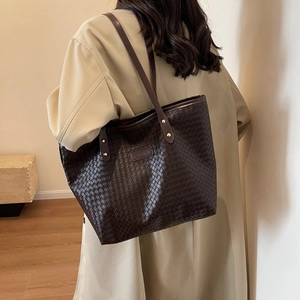 Large dark chocolate woven leather tote bag with gold rivets and shoulder strap