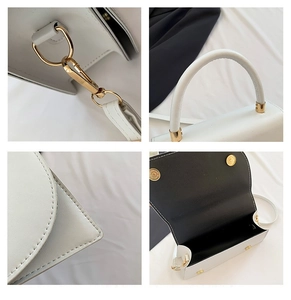 Detail view of white handbag featuring gold buckles, stitching, and magnetic closure