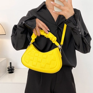Bright yellow half-moon handbag with checkerboard texture and ruched handle detail