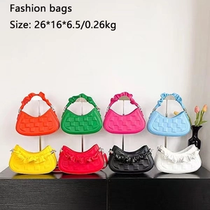 Fashionable pleated crescent moon cloud bags in eight vibrant colors on display stand