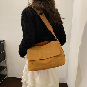 Minimalist large yellow suede shoulder bag with wide strap for women spring 2024