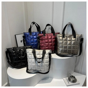 Close-up of quilted nylon tote bags in various colors with adjustable shoulder straps