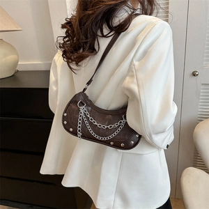Dark brown crocodile embossed crescent shoulder bag with silver rivet and chain detail