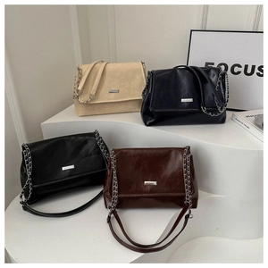 Minimalist chain flap shoulder bags in beige, black, and brown with polished leather texture