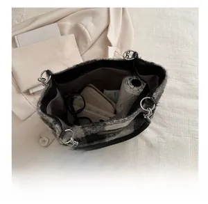 Top view of large plaid tote bag interior showing spacious storage for daily items