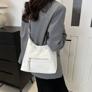 Minimalist large white leather hobo tote bag with fringe detail for daily commute