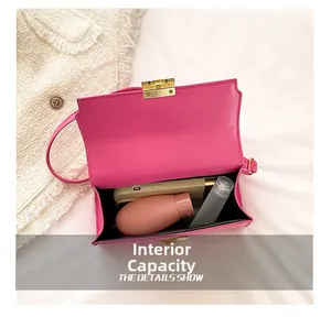 Top view showing internal capacity of the magenta crossbody bag with a smartphone