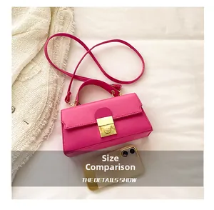Hot pink mini crossbody bag size comparison next to a smartphone on white background