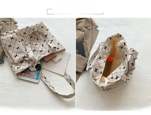 Internal view of quilted corduroy tote bag showing large capacity and bow pattern detail
