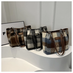 Detailed plush plaid tote bags in brown, black, and blue with leather straps and chain