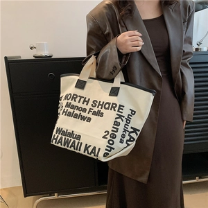Minimalist canvas tote bag with black letter print and large capacity for women