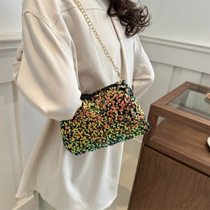 Colorful sequin crossbody bag with gold chain strap shown on model for party style