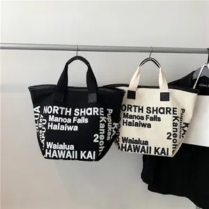 Canvas tote bag with Hawaii landmark typography print in black and off-white options