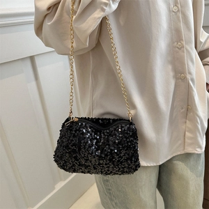 Chic black sequin crossbody bag with gold chain strap and shimmering textured finish