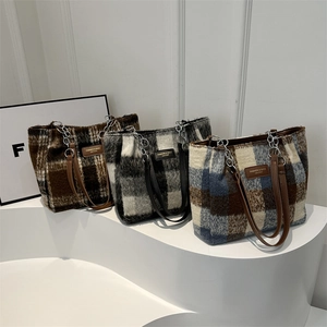 Three minimalist plaid wool tote bags in brown and grey with faux leather straps