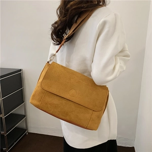 Minimalist yellow faux suede large crossbody bag with adjustable strap and flap detail