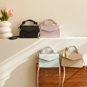 French style sequin handbags in black, pink, blue and gold with top knot handle design