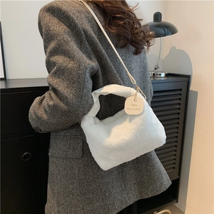 White plush tote bag with PU handle and inspirational quote tag for stylish women