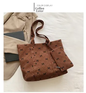 Brown corduroy tote bag with bow pattern and matching mini coin purse detail