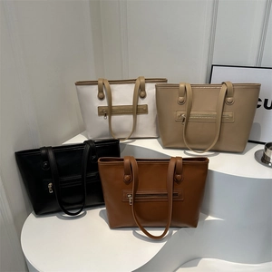 Minimalist large capacity faux leather tote bag available in four classic elegant colors