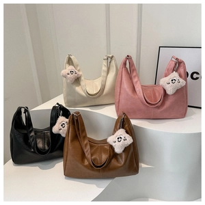 Detailed display of PU leather tote bags in four colors with star plush pendants