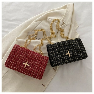 Detail of tweed crossbody bags with golden chain straps and metallic twist locks