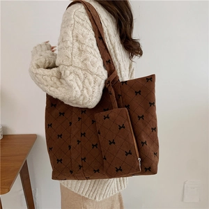 Brown corduroy quilted tote bag with black bow embroidery and matching pouch set