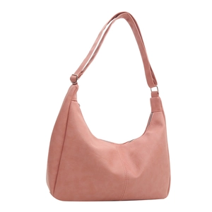 Minimalist dusty pink crescent hobo bag in soft faux leather with adjustable strap