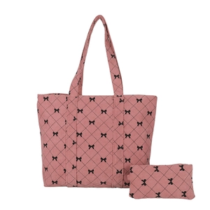 Pink corduroy tote bag with diamond quilting and black bow patterns with small pouch