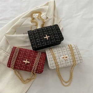 Chic tweed plaid shoulder bags with gold chain straps in black, red, and white