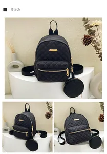 Detail of black quilted oxford backpack with golden zipper and mini coin purse pendant