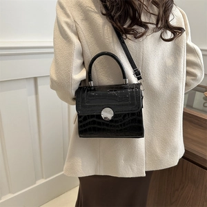 Chic black crocodile pattern handbag with silver round lock and hard top handle